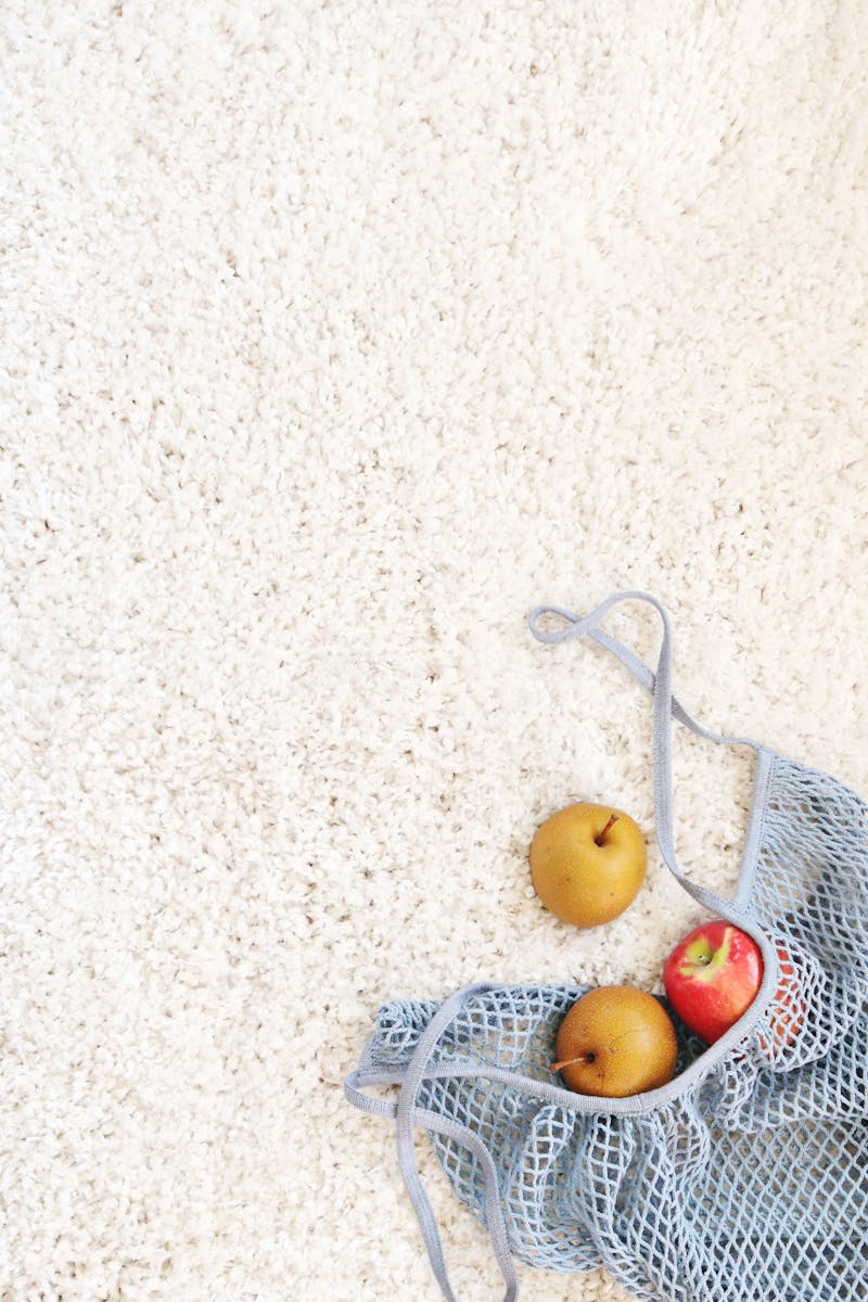 Three Apples on White Rug